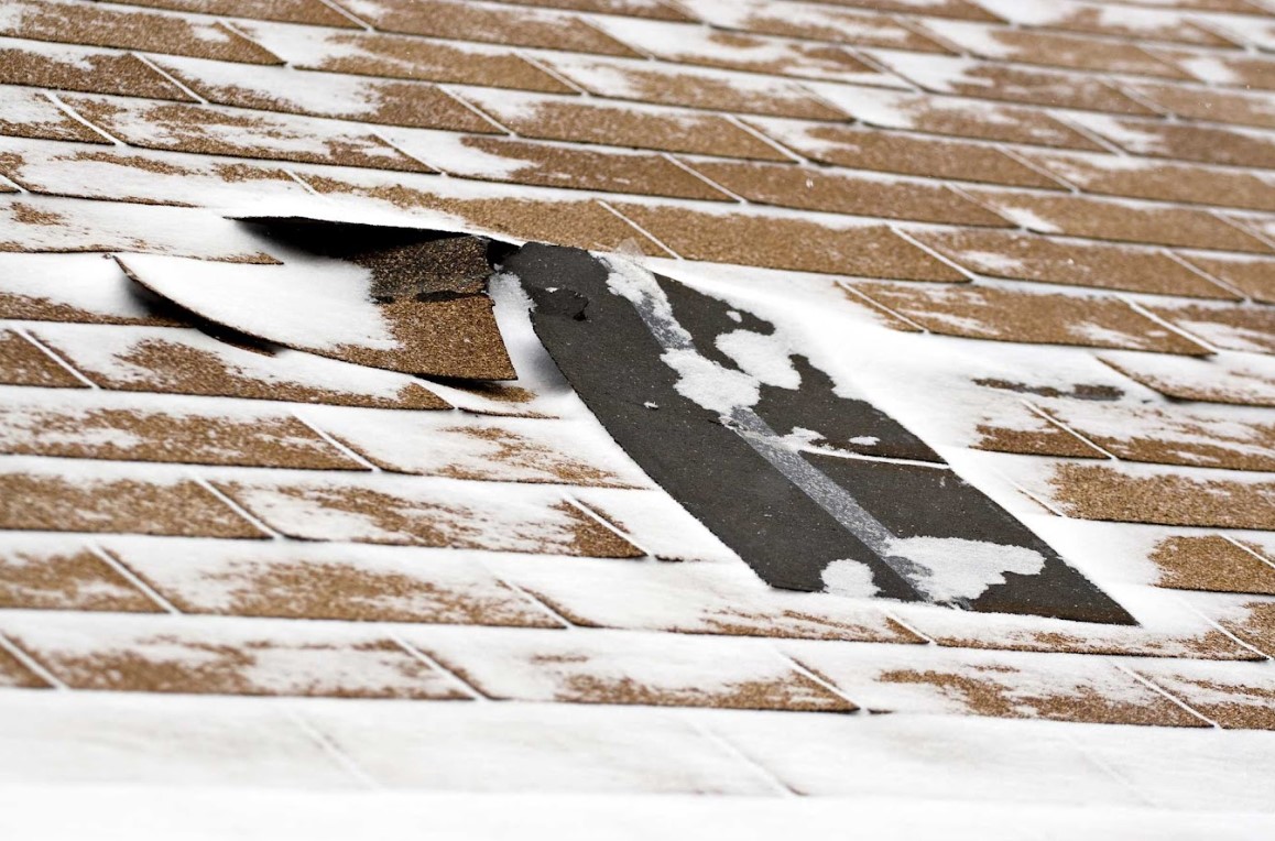ice expansion inside roof cracks and shingles